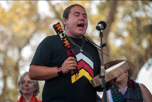 Greg Grey Cloud sings onstage at the Harvest the Hope #NO KXL benefit concert on Sept. 27, 2014.